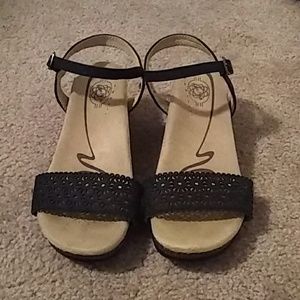 Padded strappy wedged sandals.